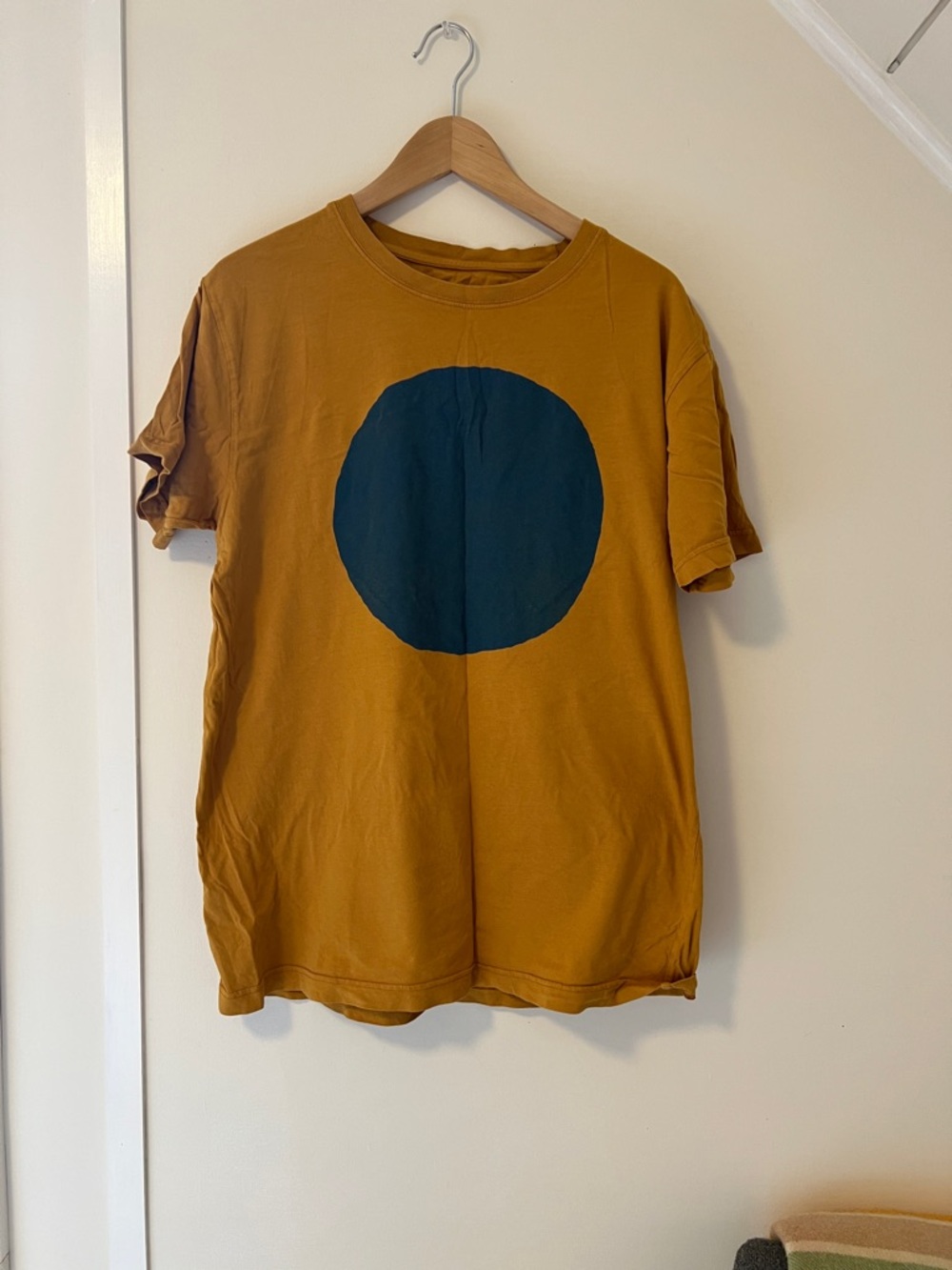All Roads Circle-T. 100% organic cotton sz L Mustard Yellow T with blue circle
